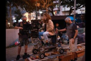 Lulu Wang Instagram - #Director Lulu Wang (@thumbelulu) and #DOP Anna Franquesa-Solano AEC (@annafranquesasolano) take us #behindthescenes of #Expats, shot with #Panaspeed lenses and serviced by #Panavision Woodland Hills.

Anna begins: 
“We wanted to capture a sense of restraint, since the three protagonists are constantly making an effort to not let go or surrender to their emotions, knowing that if they do, they will get lost. It is this attempt to keep control over their lives that influenced much of the visual look—subdued and constrained.”

Lulu continues: 
“Anna and I watched films together and also referenced photographers Michael Wolf and Christopher Anderson. We discussed how we’d visually represent this wound, this unseen thing. We also talked a lot about the contrast of the different worlds and spending a lot of time on the ground in Hong Kong gave us a lot of inspiration.”

Anna continues: 
“The reason why I went to Panavision for this project is because they have some of the best glass in the world and they were open to work with me to develop and find the look. The Panaspeeds gave us the control over the image that felt appropriate for the look. After performing some tests, Dan Sasaki modified them to be less sharp, softening the bokeh, controlling the flare to a minimum, and having very subtle glare around highlights, so we didn’t need any filtration during the shoot. 
We kept the look very clean, with no aberrations or flares to soften the reality that these women have to go through.”

Lulu concludes:
“The scale of EXPATS was far greater than anything I’ve done before, and it gave us a ton of runway to play with different visual languages and thematic ideas. It was important for us to be expansive without losing the intimacy or specificity for each character and their particular world. 

I became a director because I wanted to tell stories that transport you to another world and into another perspective. What keeps me inspired these days is collaboration. I love how collaboration expands my worldview and it helps me to continue learning and growing.”