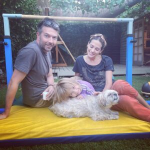 Lyndsy Fonseca Instagram - Romi:2005-2021.  She’s been with me through it all. Starting at 19. I was a baby. But she was my baby at just 8 weeks. We traveled to so many places. She was my best friend. My companion during so many new hotels. New jobs. New states. New trailers. She was with me every step of the way. Always quiet when we were rolling on set, and always charming the crew. She was teaching me how to be a mother. How to give love unconditionally and selflessly. She was tough as nails. She treed a bear! True story. She played hard with big dogs. Not a lap dog. She was independent and self assured. Her favorite was east coast autumn weather. Chilly days at the beach with low tide, that’s when she’d hop like a bunny. She loved people. And people loved her. Wasn’t a fan of Greta during her pulling hair faze. But even then she learned. And they eventually became great pals. She’d look up at me while Greta would walk her on leash and I knew she was humoring Greta. Allowing the chaos of it all. Obsessed with table scraps and any treat. Wasn’t a fan of hot days. Until the end. Her last few days the sun was calling her name. She was searching for the other side. Wanting to be alone and bask in the light in our backyard. She stopped wanting treats. She didn’t have the energy anymore. She told me with her eyes that she was ready. My sweet girl. I’ll forever be grateful of the adventures we took. The joy she gave me. The laughter. Today I feel an emptiness I can’t imagine will ever go away. This sadness is deeper than I expected. But I know time will heal. Noah reminded me that to honor her we must remember to feel the wet sand under our feet and take the long walks like we did with her and feel the breeze just like she reminded us to do in her life. Live every moment in its fullest. I love you Romi. Thank you for being my everything for 16 wonderful years. She died in our arms in a sunny spot in our yard with a vet who helped her fall asleep peacefully. She looked in my eyes and we said goodbye. See you on the other side sweet girl.