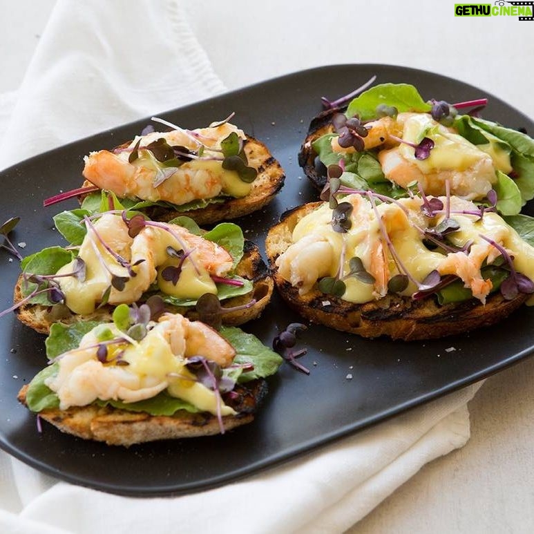 Maggie Beer Instagram - Looking for an entrée that will delight your guests? This Poached Prawn Bruschetta with Wasabi Mayonnaise is a feast for the senses, as the moreish prawns are poached in a delicate combination of lemon, Verjuice, Extra Virgin Olive Oil, sea salt and fresh, aromatic parsley. View the recipe via the link in our bio. #makeitamaggiemoment #entree