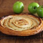 Maggie Beer Instagram – A feast for the eyes as well as the taste buds, this Fine Apple Tart champions the fresh flavour of apples. Complemented by honey and a dash of Maggie’s famous Verjuice, serve a slice with a heaped dollop of Maggie Beer Rich Vanilla Bean Ice Cream. 

View the recipe via the link in our bio.

#baking #recipe