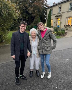 Maisie Adam Instagram - My brilliant Nanna passed away on Saturday, exactly one month after our last shared birthday. 
I absolutely adored her. She was a truly phenomenal woman with an incredibly witty sense of humour, an impeccable style and love of bold colours, and she had the kindest heart I’ve ever known. 

Whoever you were, she would instinctively hold your hand within 5 seconds of you sitting down with her. When she held your hand she would always comment on how cold they were before following that with a smile and “You know what they say about people with cold hands? Cold hands, warm heart”. 

She was one of those people who did life exactly how you’re meant to do it. Fully, with a sense of humour, fierce determination, and a flat-out refusal to be told she couldn’t do something.

She was my Nanna, but to be honest she was a best mate as well. She gave me so much over the years; endless advice, life motto’s, jokes, tips, and catchphrases which I’ll pass on to my grandchildren one day. 
She taught me how to tell the time. 
She told me to never bother with people who are unkind. Ever.
She let me use her landline to vote for One Direction to win X Factor because “they seem like nice boys”.
She was just the best.

To spend a minute with this woman was a hoot, so to have had thirty years with her as my Nanna was the treat of a lifetime.

I’ll miss her so much, but every time I hold someone’s cold hands I’ll think of the woman with the warmest heart. 
Dorothy Adam 24.01.1930 - 24.02.2024 ❤️

1. Newby Hall miniature railway being graced with her presence
2. seriously considering adopting this lamb that came in to visit her Care Home 
3. She would constantly try on Mike’s glasses which resulted in a bit of a Barry Cryer aesthetic
4. when I took this photo of her and my brother and she decided to shake his hand, resulting in it looking like an announcement of a League Two player signing a loan deal for the rest of the season
5. post-Panto, seconds away from saying “Cold Hands Warm Heart” to me. 
6. Seconds away from saying “Cold Hands, Warm Heart” to Mike. 
7. Christmas dinner 
8. The original inspiration for the album art of Lady Gaga’s ‘Joanne’
9. Birthday Queens 👯‍♀️
10. ❤️