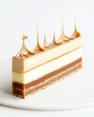 Maja Vase Instagram - Seven layers of salted caramel, peanut, and passion fruit 👑

From the top: Glittering chocolate spires, light peanut butter mousse, tangy passion fruit jelly, light passion fruit mousse, chewy passion fruit caramel, moist flourless peanut cake, and crunchy caramelized peanut base ✨