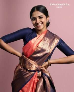 Malavika Manoj Instagram - Capturing Elegance 

 @malavika_manojj wearing: Traditional copper tissue saree in self design with contrast defined border in peach and navy blue combination

#swayamvarasilks #malavikamanoj #joemovie
#kerala #trending