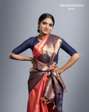 Malavika Manoj Instagram - Capturing Elegance 

 @malavika_manojj wearing: Traditional copper tissue saree in self design with contrast defined border in peach and navy blue combination

#swayamvarasilks #malavikamanoj #joemovie
#kerala #trending