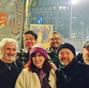 Maria Doyle Kennedy Instagram - I can’t tell you what a magnificent experience it was playing live again, that I made myself a feather crown might be some indication I suppose 😊 , so many feelings , ALL the feels. Thank you to everyone for coming to see us, especially those who braved such long journeys . Thank you Robert, Andrea #Parterre , Henri and Michael #CafeBarMokka , Viktor and Marten #ElLokal . #LiveMusic #community #❤️

The first photo was taken on our very first Swiss tour in 1992 , Sunday’s feather crown, onstage with Erica Stucky #ElLokal 2020 , all the band (Jimmy Bastard) that we toured with in 1992 came to our show on Sunday night, walking home after the gig xxx