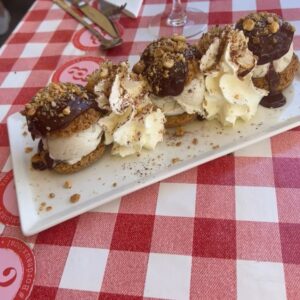 Maria Hering Instagram - Photobomb of our lunch today .. back in the south west of France 🇫🇷 I’m not a big fan of profiteroles but this one’s where excellent 😋 I also try to take it easy with dessert and sweets which is extra hard in france .. 😅.. positive message of the day .. embrace and cultivate loving yourself every day a bit more .. self love, is not selfish 😘🫶
.
#enjoythemoment, #memories, #powerofpositivity, #creativity, #love, #lunchtime, #capferret, #grateful, #thankyou, #bepresent