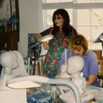 Marie Osmond Instagram - I had to show you the Christmas present I gave my son Matthew!🎁 When I was designing and sculpting dolls for 25 years, I designed a doll for each of my children… Well, I don’t know what happened, but I never designed one for my son Matthew. So I fixed that this Christmas!! I called my dear friend and amazing doll designer, @karen_carlson_scott , and asked her if she would sculpt a doll for my son. Her work is undeniably amazing! She’s the one I commissioned to do Baby Oprah and Baby Donny, as well as Baby Peggy, Baby Elvis, and me…Baby Olive Marie! 😉 I sent her photos of my son when he was a little boy and told her Matt was a red sweatshirt, blue gym, shorts, flip-flop kind of kid! 🥰 I couldn’t have imagined it turning out more perfect! You should’ve seen Matt’s face Christmas morning when he opened the box!!❤️ Thought you’d all like to see Karen‘s masterpiece. Thank you, my dear friend, you’re the besst! I also want to thank my dear friend and colleague for all the years I designed my dolls, @northernarizonaliving , for helping coordinate Karen and myself throughout this amazingly fun project. Love you, Peggy!❤️🥰 PS I’ll have to tell you all another time about the miracles that occurred for Karen while making this doll…they’re pretty remarkable… like her!!!! ❤️