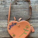 Melanie Lynskey Instagram – I got to have a poppet date night on Wednesday and celebrate the launch of this amazing collaboration between @coach and @observedbyus and @kirstendunst. These pieces are so special and so unique and beautiful, clearly made with love and as a result of such a sweet friendship. There are ants on this heart bag!! It’s so charming! Every person at the dinner was wonderful and it really felt like hanging out with friends. You know how people always ask “who would you have at your dream dinner party?” Well now I know my answer, and it includes @stuartvevers @domfishback @observedbyus @kirstendunst and Jesse @hilaryduff @matthewkoma @negga.ruth @addison.timlin @evanrosskatz and my poppet @magslawslawson. And getting to congratulate Dom on the Emmy nomination I NEEDED to happen was so joyous. Feels a bit funny to post about anything other than the strike, but this really was a special night and is a super lovely collaboration and I wanted to say thank you 💖
Hair!! @dickycollins- makeup! @kristeeliu – styling and running all over town! @misha_rudolph_stylist 
Images: @bfa @jojo_jpeg @matthewyoscary
Edited to say these shoes are also @coach !! Because people are rightfully very excited about the shoes