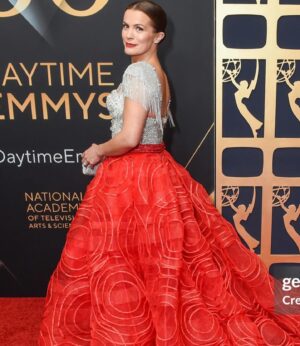 Melissa Claire Egan Instagram - The story of THE DRESS! @theolivertolentino has been so good to me! I screen shot this dress on his Instagram over a year ago and said, “if I’m ever nominated again, I have to wear this dress”. Cut to last spring, I was lucky enough to be nominated, but was going to be 7 months pregnant at the Emmy’s. Oliver said no problem, he would make me the “pregnant version” of this dress. Could you die?! It was a shortened bodice and the skirt became more empire waist. Then the strike happened and the Emmy’s got pushed and here we are with the original version of the dress! Oliver has been so wonderful and I’m forever grateful to wear this piece of art!💃🏻❤️