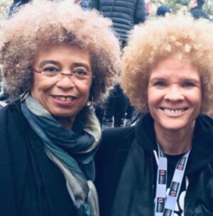 Michaela Angela Davis Instagram - a lil ode to my afro on 
world afro day

my afro is a world
of naps holding tight to
each other 
reaching, rising up & out 
cacophonous curls 
refused to be ruled
linked & loc’d
forming a crown of gold
round my face 
roaring like a mane 
glowing like a halo 
my afro is the satellite 
to the ascended masters
the ancient ones 
the angels
the ancestors 
#WorldAfroDay #passtheCROWN