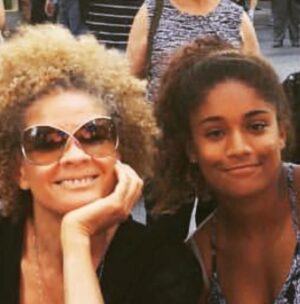 Michaela Angela Davis Instagram - a lil ode to my afro on 
world afro day

my afro is a world
of naps holding tight to
each other 
reaching, rising up & out 
cacophonous curls 
refused to be ruled
linked & loc’d
forming a crown of gold
round my face 
roaring like a mane 
glowing like a halo 
my afro is the satellite 
to the ascended masters
the ancient ones 
the angels
the ancestors 
#WorldAfroDay #passtheCROWN