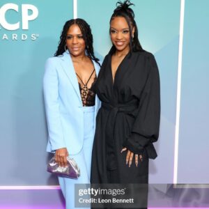 Michelle Mitchenor Instagram - @naacpimageawards NOMINÉE Brunch 🥷✨
Trench Set : @beeombi 
Earrings : @veronicatharmalingam 
Clutch : @cultgaia 
Makeup @theninjafilter 
Hair : @stylesbydavonte 
Nails : @theonlynailsofficial 
Wedding Ring Set : @emilyesterling 
Thank you @pr_solo