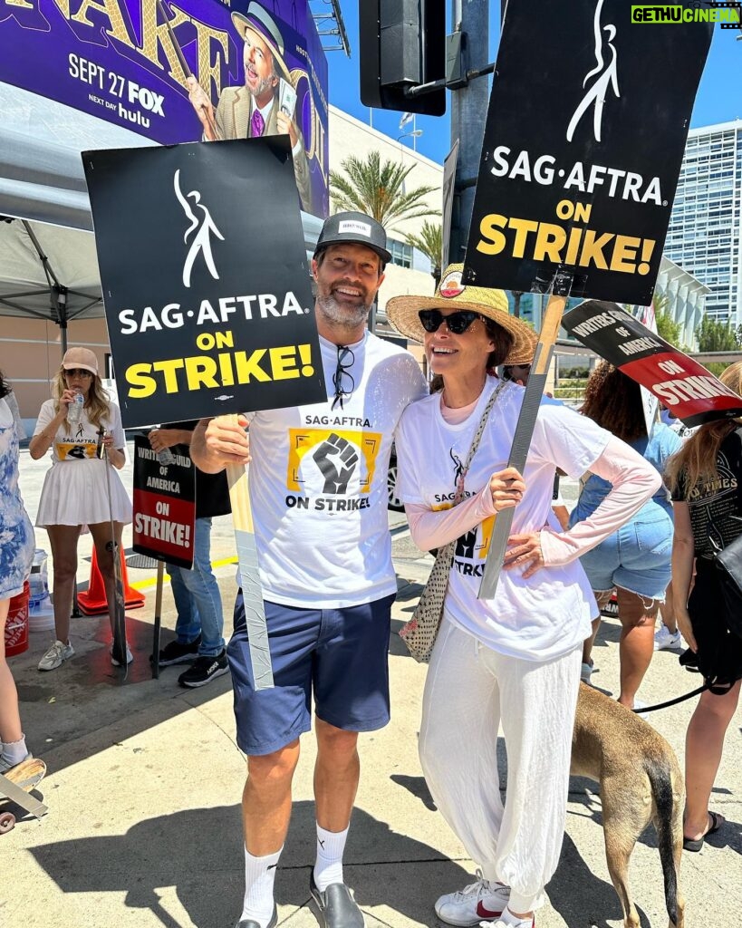 Minnie Driver Instagram - Me and Stults hit the picket line in support of our union and the Writers Guild Of America. Such a huge inflection point in our industry, really good to meet and chat with a few people who’ve been walking the lines since day 1. #sagaftra strong #wgastrong @geoffmstults