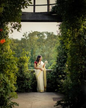 Nandini Sree Instagram - The golden streaks of saree seamlessly blended into the European landscape of the Pergola.. the sun kissed happy hour created the perfect frame for this beautiful series by @blooomf ❤️!!!

#photography #nandinisree #photoshoot #onam #onamsaree #aestheticphotography