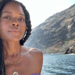 Naomie Harris Instagram - Thank you @magmaresortsantorini for hosting me at your magical resort in #santorini #greece organised by @beyondtalentglobal & @swot.gr 🙏🏾 I have travelled all over the world for work, but usually for no more than 48 hours. I get to a new country, go straight to the hotel, and into hair and makeup to get ready for whatever press engagement I’m there for, so I don’t really get to actually see the country I’m in. I’m determined to change that pattern, so when @omega invited me to #mykonos I decided to stay a week extra to explore a bit more of Greece. I traveled to #Paros first and then onto Santorini… and I can honestly say of the 3 Greek islands I visited, it was Santorini that captured my heart. Although I’m not sure if it was the feel of the island as a whole, or just the magical, healing and calming energy at @magmaresortsantorini Either way, I’ll definitely be back!! 🌟 🙏🏾 @seasanto_boat_cruises for the incredible boat tour! 👙 @awaythatday