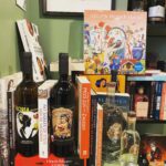Natalia Tena Instagram - Yesterday I found my happy place in Ghent @bookznboozegent. Incredible bottles of wine and spirits nestled amidst beautiful books according to theme interspersed with records. This section is the strong ovary section. Alcohol made by women, books written or starring strong female leads. I hung out there a good while with a glass of Gloria wine. PLEASE OPEN A BOOKSHOP LIKE THIS IN LONDON!