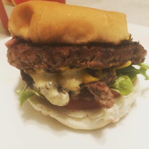 Natalie Desselle-Reid Instagram - Saturday night this is all I need! But I’m missing the kale 🥬 chips. Homemade burger with arugula, red onion,a slice of tomato, and some POPEYESSSS 👀 blackened ranch🤣 sure made my eyes pop😁😁😁