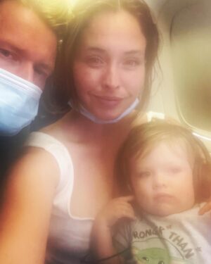 Natalie Krill Instagram - I asked Daniel if he minded me posting this photo and he looked at me like wtf? And mumbled….sure if you want to….. 
yes Daniel, I’m still over here living my life with this cracked selfie camera!! 🤣
Memory of my cute little family on an airplane. ❤️