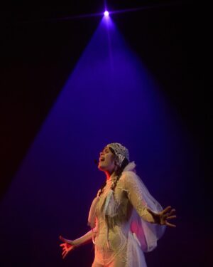Natasha Khan Instagram - The Motherwitch is here {{{🥚🌀🥚}}}

Returning to a London stage last night was unforgettable. The energy, the love, and being surrounded by family and friends old and new 💫

Thank you to everyone who came and shared your night with me, you fuelled every moment of the performance. 

My deepest gratitude to everyone who made this show possible, to the fans, to @christineandthequeens for inviting me to do Meltdown at @southbankcentre and to @avalon9000 & The Charm for supporting. 

📸 @milovangiap 

Musical Director: @benchristophers 
Viola / Violin / Vocals: @violetavicci 
Live Arrangement: @batforlashes @benchristophers @violetavicci 
Live Creative Director: @hannahmarshall_______ 
Live Creative Assistant: @junsong___ 
Lighting Director: @joshieharriette 
Movement Director: @alexandra_green__ 
Creative Producer: @tigerhaginoreid 
Costume Designer: @juicylames 
Costume Designer: @agrostudio_ 
Crochet Maker: @maddyrara 
Set design: @zoeklinck 
Hair: @moemukai23 
Management: @giantartistmanagement @tigerhaginoreid @richaustensmith @islafab 

More exciting news to come….. 🦇