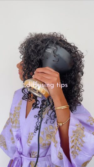 Nia Pettitt Instagram - The key to getting ✨ BIG ✨ hair whilst keeping definition is by starting off slow to set your curls. Tip your head the side or down to allow the air to travel through to the root. Once your hair is almost dry, you can start speeding up the motion and massing your roots for that instant lift. Use code NIA15 for 15% off your own Diffon Supreme to get the curls of your dreams #Ad #YouAreBellissima @Bellissima.UK 🧖🏽‍♀️✨💜💐
