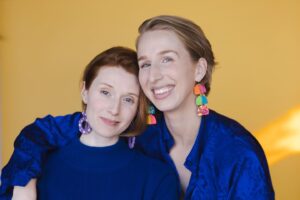 Nicole Tompkins Instagram - We hand made earrings out of clay. And then took silly photos to show them off. Such crafty beans. HAPPY MONDAY HAVE A GREAT WEEK. 

Also we will be signing live tomorrow for Valentine’s Day and if you would like a print the shops are open 🌙💛⭐️💝 Come by anyway… because there are UPDATES. 

Streamily.com/nicoletompkins
Streamily.com/maggierobertson

Xx 
Niki   Magz