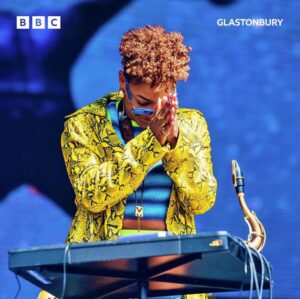 Nubya Garcia Instagram - Thank you @glastofest !! 

thank you to everyone who came to see us play at @westholtsofficial love to you alllllll for your energy during the show ! 

Love always to @barrelljonesmusic @casimirdaniel @joeajkeys @officialjaybay @skaaats @jab_perc for bringing everythingg✨

Love and thanks for the amazing visuals from @akinoladaviesjr @creamprojects @ranyaelrefaey @ryanhawaii @mai_ye & to @shirleyoamartey for the 🔥 🔥 fit & my team @sbmusicmanagement @marinajgb @bofsb12 @markscurr  @sahansatis @concordjazz @adrwilliams @tayo.rap @nathan_g_anotheraccident @josephdonohue @thetomlights 

fit: @agrknit @alighieri_jewellery @gentlemonster @juliaseemann 
shoes: @katmaconie 
hair: @datbarbernat 

listen/ watch back on @bbciplayer @bbc6music