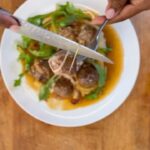 Nyesha Arrington Instagram - I LOOOOVE a comfort meal moment.. and you guys know I am a big fan of soup & stews.. SoooO.. in this recipe, I use the inspiration of French onion soup 🥣 Capturing its soul hugging capability 🤗 Starts by caramelizing onions, then deglaze with sherry wine, added in beef stock and cooked down to a beautiful, rich gravy.. ALSO- I had ground beef in the freezer so made some meatballs... but even more ALLLSO- had some string cheese, so stuffed the meatballs with cheeeez Japanese sweet potato mash rounds out this meal of comfort... and I absolutely love food like this because it's relatively inexpensive & pretty simple to make if you have patience to fill the meatballs individually. Ground beef was $12 [16oz] Stock was homemade [so basically free] 1 onion $.65 Homegrown thyme 1 bay leaf Couple tablespoons of sherry wine [and I tossed the cheese in a little cornstarch before filling the meatballs] A few sticks of string cheese $.40ea Cooked the stuffed meatballs in the broiler, in the French onion soup base, which took like 6 mins roughly. I got about 16 meatballs out of the pound of meat Finished with a little parm, arugula & blk pepper