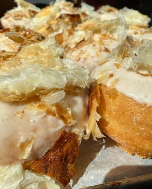 Paola Velez Instagram - Quesito donas (donuts) | cream cheese filling, leche icing, candied puff pastry 

#quesito