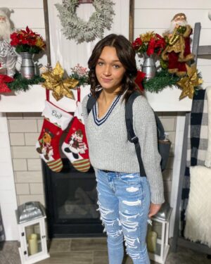 Peyton Evans Instagram - First day at new Jr High. Gotta love my hugs from my kitty cat Damon. 
Fit: @americaneagle #peytonkaye #americaneagle