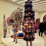 Piper Perabo Instagram – Ever since I saw a film of @nickcaveart Soundsuits dancing on his Instagram, I have been waiting to see his art in real life. Finally it happened, his show #forothermore at @guggenheim will bend your imagination and open your eyes. Run don’t walk, or better still, dance over there. (A curator told me Cave recommends seeing the floors in the order 4, 2 then 5. It is cool that way.) ✨✨✨✨✨🖤🌸
•
Nick Cave’s (@nickcaveart) art practice interrogates promises, fulfilled or broken, that late 20th and early 21st centuries offered to the “other.”
 
Our newest exhibition, “Nick Cave: Forothermore,” highlights the development of Cave’s work while creating space for those who feel marginalized by dominant society and culture—especially working-class communities and queer people of color. – @guggenheim