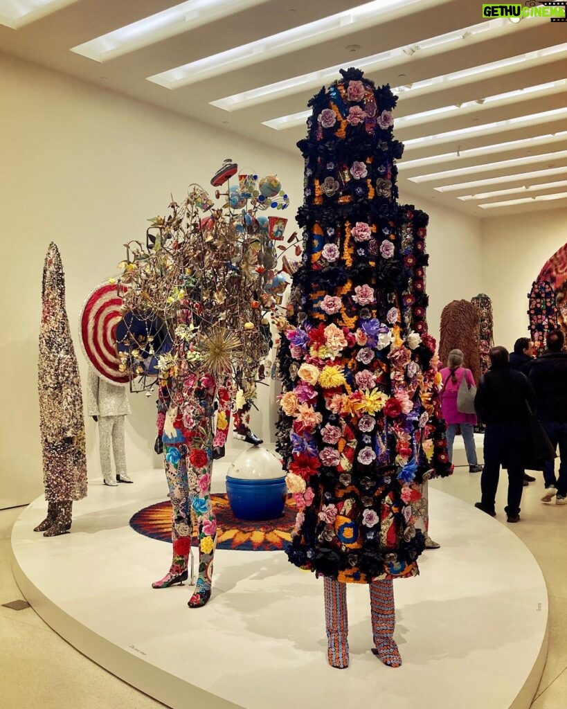 Piper Perabo Instagram - Ever since I saw a film of @nickcaveart Soundsuits dancing on his Instagram, I have been waiting to see his art in real life. Finally it happened, his show #forothermore at @guggenheim will bend your imagination and open your eyes. Run don’t walk, or better still, dance over there. (A curator told me Cave recommends seeing the floors in the order 4, 2 then 5. It is cool that way.) ✨✨✨✨✨🖤🌸 • Nick Cave's (@nickcaveart) art practice interrogates promises, fulfilled or broken, that late 20th and early 21st centuries offered to the “other.” Our newest exhibition, "Nick Cave: Forothermore," highlights the development of Cave’s work while creating space for those who feel marginalized by dominant society and culture—especially working-class communities and queer people of color. - @guggenheim