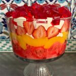 Poh Ling Yeow Instagram - Ok I finally got my shizen together this year & wrote a recipe for the retro Yeow trifle which is ‘special’ because it uses NO fresh ingredients bar the strawberries 🤔. Every time I’ve deviated ever so slightly into fancy, someone will comment “HOW INTERESTING YOU USED SOUR CHERRIES & HOMEMADE CUSTARD THIS YEAR” - code for “Why did you turn this into something unpredictable”. Anyhoo, i guess the moral is if it ain’t broke - enjoy! Merry Holidays everyone!!! ♥️⭐️ YEOW FAM RETRO TRIFLE 3 packets 🍓 or raspberry crystals 4 Tbs powdered gelatine or 10g sheet gelatine 1 x 6 pack mini jam rollettes, sliced 1.5cm 2 punnets strawberries, slice enough to cover the diameter of the trifle bowl, cut the rest into 1cm cubes. 825g tin sliced peaches, drained 2-3 cups custard (powdered kind - make using packet instructions or u can use home made creme patt of course) 1 cup thickened cream, whipped with 2 Tbs full caster sugar & 1 tsp vanilla or strawberry essence until medium - stiff peaks Make 2 packets of the jelly following the packet instructions but add the extra gelatine. Stir until all the crystals are dissolved then pour into a flat 25x20cm-ish tray or dish. Chill in fridge for 2 hours or until set firmly. Make the remaining packet of jelly using regular packet instructions. Set aside. Arrange the jam rollettes on the bottom of the triffle bowl (about 4L capacity). Pour the warm jelly mix over the rollettes making sure all the pieces are soaked through. Layer as follows: 1/2 of the custard, peaches, remaining 1/2 of the custard, strawberries, whipped vanilla cream. To finish, slice up your finger jello into cubes and rain them over the cream piling them as high as possible. Chill for 2 hours so the jelly in the bottom is set. Serve with a smol shovel, dive in and hope jelly cubes don’t wind up bouncing all over your mum’s carpet 🤭😚
