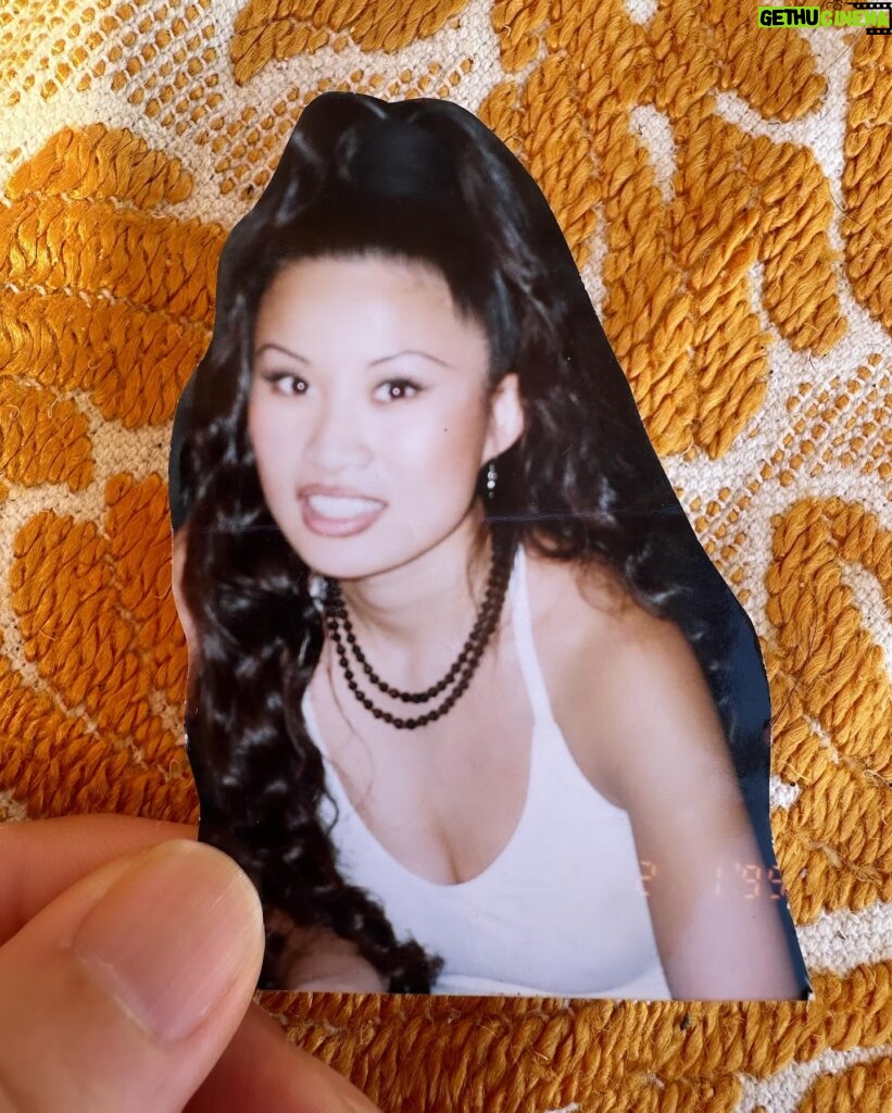 Poh Ling Yeow Instagram - Just found this in a basket of plastic string in Aunty Kim’s McGyver cave. I have a shocking memory but roughy this look is circa 1995 (so I’m around 20-21) and yes that’s my real hair which I used to curl with old school rags, because back then u couldn’t just grab a hairpiece from Temu for $10 but even if I could I woulda bin busy saving to scoot back to Utah so I could find me a Mormon husband and procreate asap 😂. Fate had other plans. This was the soundtrack of the era - probs a bit telling of my recent return from OS where I had my cherry popped by, lets just say, every mother’s nightmare, got my belly pierced, never witnessed such joyous multiculturalism and one of my my besties was trans. It was a time of rebellion, immense turmoil and philosophical change. I felt wild with wanting to be desired, and although I wasn’t a model church member, I spent most of this period cowering from my truth and feeling like a despicable sinner. Despite all this, the goal was still to get back on track and contort myself into the wholesome mould I believed would give me the stillness & acceptance I craved. Just a small part of a story that reminds me how I earned my 50 years and how much youth kinda sucked 😂! Happy Friday, folks!