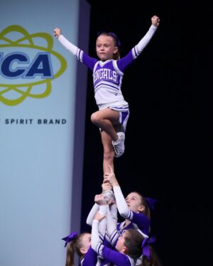Rachel Reynolds Instagram - So proud of this girl and her teammates performing on a national stage!  They were fantastic!!! 💜🤍 #geauxbengals
