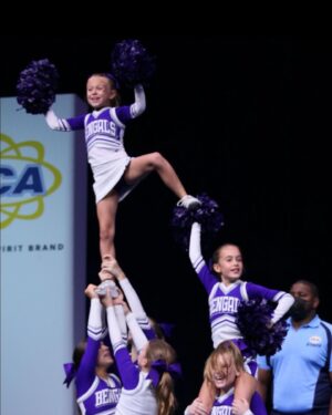 Rachel Reynolds Instagram - So proud of this girl and her teammates performing on a national stage!  They were fantastic!!! 💜🤍 #geauxbengals