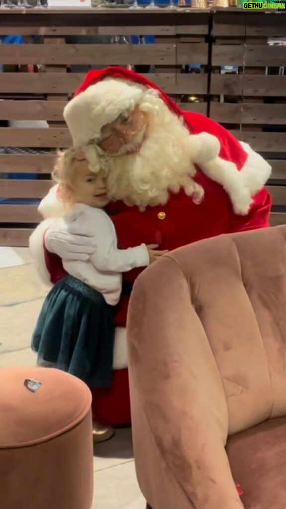 Rachel Riley Instagram - You know how kids are scared of Santa the first time they meet him, well for poor old Santa, that only lasted about 30 seconds 😂 Littlun took a shine, first to the elves and quickly upgraded to the big man himself 😆🎅🏼 Big thanks to @hamleysofficial for the letter writing, Santa cuddling dance party, Mykyta, Mave and Noa had a ball… I’ve filmed two Christmases on screen already so the first half of November does not feel to early to me! Feeling festive already and Christmas music feels like my safe place right now, so lovely🎄⛄️🎁🍸