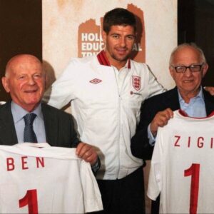 Rachel Riley Instagram - Today on Holocaust Memorial Day I want to pay tribute to two wonderful men I have the privilege of meeting while they were alive, who we’ve sadly lost in this last year.

Zigi Shipper BEM and Sir Ben Helfgott were born in Poland and as children, lost most of their extended families as part of the systematic murder of 6 million Jewish men, women and children in the Holocaust. 

Sir Ben spent his youth as a slave labourer, in ghettos and concentration camps and saw unimaginable horrors. The story of his arrival in England after liberation has been immortalised as part of the story told in the BBC movie, ‘The Windermere Children’. Sir Ben overcame so much adversity to become the captain of British weightlifting team and won a bronze medal in the 1960s Olympics. He did decades of charity work, supporting fellow survivors and educating the public on the dangers of extremism and hate going unchecked.

Zigi’s childhood was spent in the Lodz ghetto, at several concentration camps including Auschwitz-Birkenau, and he survived a Nazi death march before being liberated. He came to England to join his mother, after his grandparents and father who he’d previously lived with had died or where never heard of again. Zigi too dedicated many decades educating young people about what happened in this awful period of history, and even though he suffered so much in his life, he still had such an infectious personality and was an absolute joy to be around. He too has been immortalised as King Charles (then The Prince of Wales) commissioned the portraits of seven Holocaust survivors, of whom Zigi was one, and so Zigi’s face hangs on the walls of Buckingham Palace today.

Sir Ben and Zigi were great lifelong friends, great advocates for @holocaustuk and are missed by so many in the wider community.

You can read more about them here.

https://www.hmd.org.uk/resource/sir-ben-helfgott/

https://www.hmd.org.uk/resource/zigi-shipper-hmd-2017/

May their memories be a blessing.

#Holocaust #HolocaustMemorialDay #HMD #HMD2024