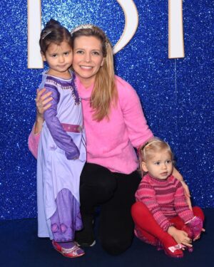 Rachel Riley Instagram - Hola! Shalom! Salaam! - one of the first lines in the gorgeous new Disney movie - Wish 🌟 

Took the girls for their first ever trip to the cinema and what a lovely experience it was. The film is a new instant classic in my book, enjoyed the girls sitting on my lap during the scary bits, wagging their fingers saying, “naughty, naughty King” 😂

I’m glad we’re in the Disney age with them now, can’t wait till they’re old enough for the parks. We enjoyed the Disney 100 exhibition together a few weeks back too, although I probably would have enjoyed it more without them and actually being able to listen to and read the displays (sorry girls!).

Thanks too for the purple Asha costume that was #gifted to Mave, lots of little girls will enjoy dressing up as her for years to come I’m sure.

#premiere #wish #disney #asha #disney100