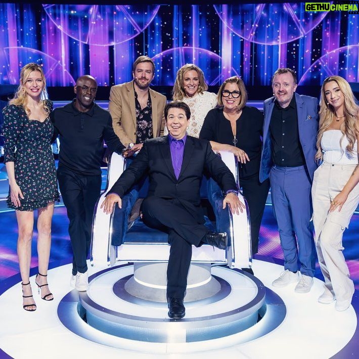 Rachel Riley Instagram - I love doing this show! Catch me with this lovely bunch on The Wheel, Saturday 24 February at 8.10pm on BBC one and BBC iPlayer @bbciplayer We only have our reputations at stake, what could possibly go wrong 😆 @chrismccauslandcomedy @gabbylogan @gkbarry_ @iaindoesjokes Stirling @lizatarbuckradio @official__djtrevornelson11 And thanks for lending me your gorgeous dress @queensofarchive 👗🌹😘 #MichaelMcIntyre #TheWheel #iPlayer