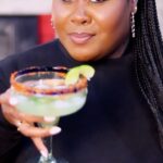 Raven Goodwin Instagram – Spicy Margarita 🍸🥒🌶️ just in time for taco Tuesday. 

Muddle up a jalapeño 
Add:
Ice
the juice of three limes
Two shots of @21seeds cucumber jalapeño tequila (not an ad just really love their tequila) 
Desired amount of agave 
Hit the rim of your glass with some lime and @tajinusa 
Garnish with lime and more jalapeños & Enjoy 

🎥 @nachaa_manaya
