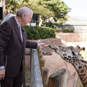 Rebecca Metz Instagram - Just saw the news that Audrey died last night. It may seem strange to mourn a giraffe, but Audrey meant a lot to me. She–specifically a photo of her beaming proudly between a bride and groom–is the reason I latched on to the idea of getting married at @santabarbarazoo. And why we’ve ended up with a lot of weird & beautiful giraffe art/tchotchkes. And this photo of Dad feeding her… Well. It’s precious to me. Goodbye, sweet Audrey. Rest easy.