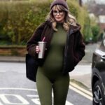 Rhian Sugden Instagram - Caught waddling about in my @bumpsuit 💚 (Not an ad)