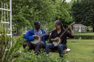 Rhiannon Giddens Instagram - “The idea of place, where we belong, is a constant subject for many of us.  We want to know whether it is possible to live on the earth peacefully.  Is it possible to sustain life? Can we embrace an ethos of sustainability that is not solely about the appropriate care of the world’s resources, but is also about the creation of meaning - the making of lives that we feel are worth living.  Tracy Chapman sings lyrics that give expression to this yearning, repeating, “I wanna wake up and know where I’m going.” Again and again as I travel around I am stunned by how many citizens in our nation feel lost, feel bereft of a sense of direction, feel as though they cannot see where our journey’s lead, that they cannot know where they are going.  Many folks feel no sense of place. What they know, what they have, is a sense of crisis, of impending doom.  Even the old, the elders, who have lived from decade to decade and beyond, say life is different in this time, “way strange”, that our world today is a world of “too much” - that this too muchness creates a wilderness of spriit, the everyday anguish that shapes the habits of being for those who are lost, wandering, searching. “ - from belonging: a culture of place, by bell hooks.

pic by @karencoxphotography, of me and @countrygentlemancooks in the garden of Etta Baker’s house in Morganton, North Carolina.