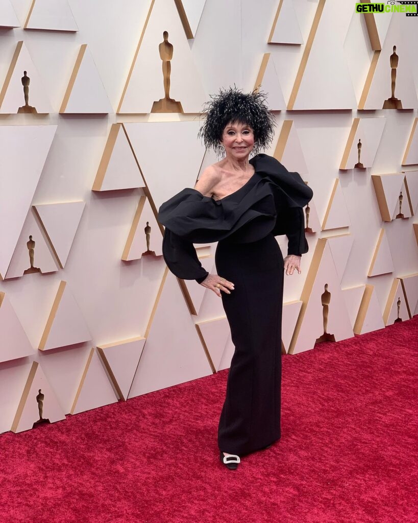 Rita Moreno Instagram - Last nights #Oscars lewk Courtesy of: @carolinaherrera (Dress) @verdurajewelry (Earrings) @rogervivier (Bag-not pictured) @adriennelandau (Feathered Hat) Hair by my #Hairapist: @annamariaorzano Make up: @mihomakeup Styled by: @rebeccarams