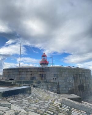 Roan Curtis Instagram - Sorry, sappy post incoming. Today I went and visited the town that my dad’s side of the family is from, Dun Laoghaire. My dad had given me a list of places to visit and the first on my list was the East Pier where my Mise (grandmother) used to go walking often. It was absolutely pissing rain and then as soon as I stepped out onto the pier, the clouds parted and this rainbow appeared. It felt like my passed relatives saying hello and welcome. It made me cry happy tears. Today I’ve visited the church where my grandparents got married, the house my Mise grew up in, the house my grandfather owned, and now I’m sitting in a pub that used to be his childhood home having a Guinness. I’ve never felt so close to my heritage and those who have come before me. I feel so lucky to be here, it’s so magical.