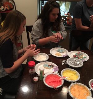 Robyn Brown Instagram - Decorating Christmas sugar cookies, eating super nachos, watching Christmas movies, drinking cocoa, and being together is what we do as a family the Saturday after Thanksgiving.  #familychristmastraditions #sugarsprinklesonthefloor #loudandfun #christmascookies #christmasisrightaroundthecorner