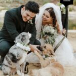 Samantha Hanratty Instagram – The day of her dreams ✨ Yellowjackets star Samantha Hanratty is MARRIED! Samantha and *now husband* Christian DeAnda went on a hike on their first date, Samantha says in that moment she knew they were “in it for the long haul”. Now they are taking their first steps as husband and wife, just three years later. 🤍  Head to the link in bio to get the exclusive first look at photos and details from the couples’ stunning day. 🙌

Ceremony and Reception Venue: @terramiapr
Photographer: @michellerollerphoto
Videographer: @loveinfocusfilms
Coordinator: @blushandtwinedesigns 
Event Designer: Ellen Hanratty
Florist: Diane Lannon
Officiant: Christopher Senderling
Wedding Dress: @chicnostalgia via @epiphanyboutique_slo 
Bridal Shoes: @Aldo
Groom’s Suit: @menswearhouse
Engagement Ring: @jamesallenrings
Wedding Rings: @jamesallenrings and @jaredthegalleriaofjewelry
Hair: @tigerlilysalon // @conscious_kate
Makeup: @marykula_mua
Invitations: @TheKnot and @paperlesspost
Catering: @ribline
Cake: @crushcakescafe
Desserts: @monikasmacarons, @sweetpeabakery, @crumblcookies, @nowheychocolate; 
Music: @caliwestdjs1
Entertainment: @tj_booth, @bumble
Bridesmaids Dresses: @birdygrey
Custom Cake Cutter/Server & Champagne Glasses: @elenahonch.wed
Rehearsal Dinner Venue: @Patinapaso // @CalCoastBeer
Beer: @FirestoneWalker Wine: @Sextantwines