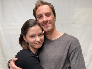 Sandra Mae Frank Instagram - Get ready to meet Elizabeth Wilder’s brother, Adam (played by #GarrettYoung), tonight on #NewAmsterdam! 👩🏻‍⚕️

10/9c on #NBC, next day on #PeacockTV and #Hulu

💙 EP 13 - #Family 💙
Written by #DavidFoster
Directed by #OlenkaDenysenko

#DamFam #DrWilder #Wilders4Life #Siblings #ElizabethAndAdam 

[image description]
First photo - through the camera lens with settings around the corners, Wilder sitting on the bed with her TV brother, Adam. Both look cheerful. 
2nd photo - Close up of Wilder with her TV brother, both hugging and smiling, looking at the camera.