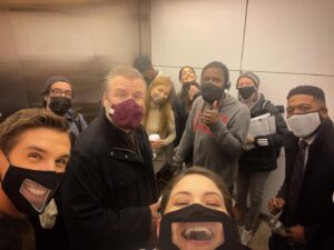 Sandra Mae Frank Instagram - Back with the #DamFam, at 10/9c tonight on #NBC!

Directed by #NickGomez
Written by #GrahamNorris

#NewAmsterdam #DrWilder #WeAreBack #Revolution #Season4

[image description]
A group of cast and crew members riding the elevator, wearing masks and looking at the camera, smiling.