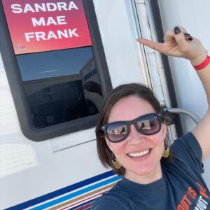 Sandra Mae Frank Instagram - Y’all ready for #SuperBowl2022 tomorrow?! 

Catch me performing the #PreGameShow (with #MickeyGuyton and #JheneAiko)

THEN catch #WawaSnipe and  #SeanForbes performing the #HalfTimeShow (with #DrDre, #SnoopDogg, #Eminem, #MaryJBlige, and #KendrickLamar)!

To access the full #ASL performances, watch on a separate device via NBC Sports App (or go to their website) while watching the game on your TV screen! 

Thanks to #NAD for their support on this incredible journey! 

🏈🎶🤟🏻

#SuperBowlShow #ASLmusic #Music #NBC #NBCsports #DeafMusic 

[image description]
Sandra Mae smiling, wearing black sunglasses, standing in the front of her trailer and pointing at the sign in white text with a red background, “Sandra Mae Frank.”